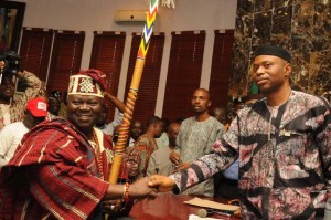 Late Oba Adebiyi Adesida receiving his staff of office from Gov. Mimiko