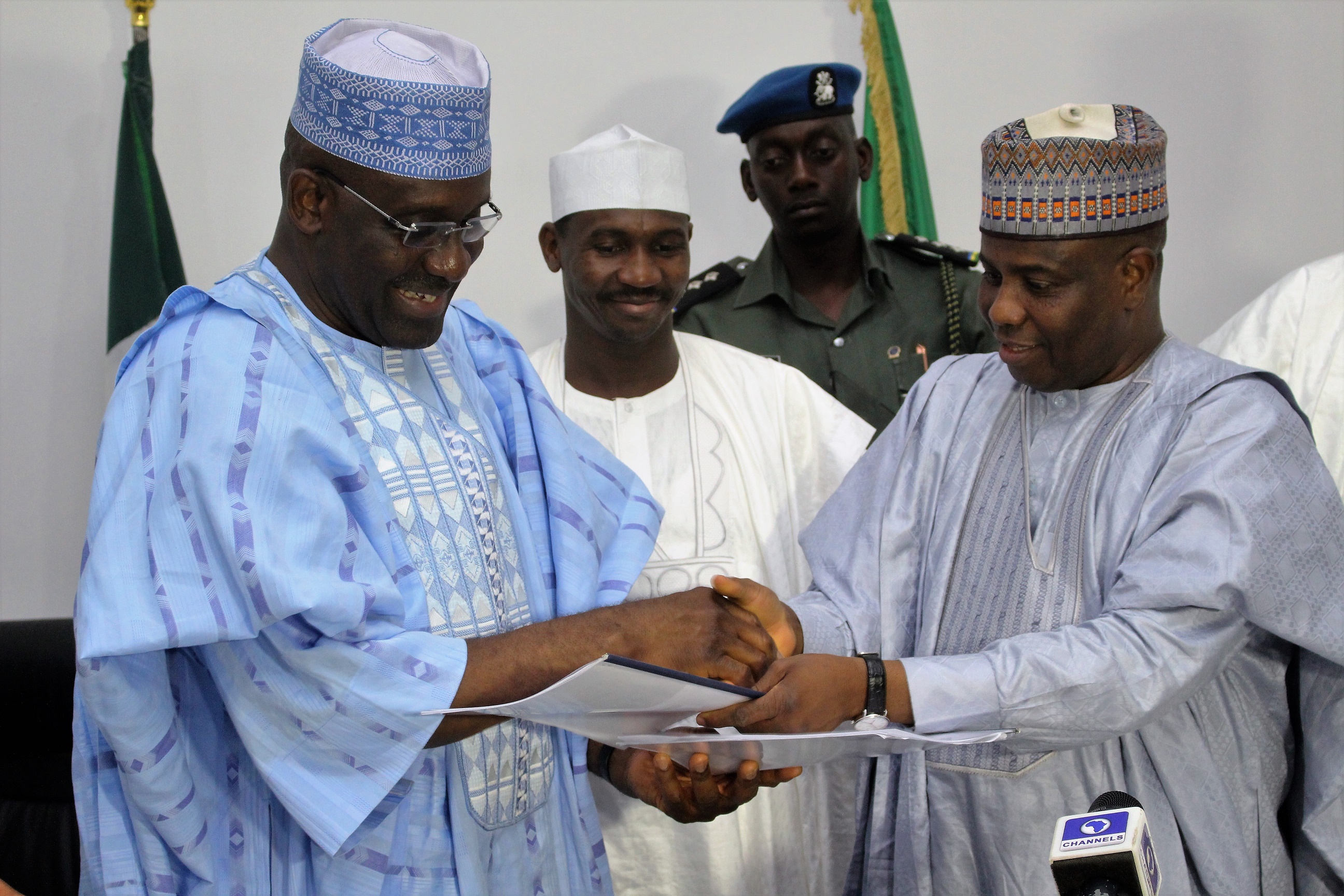 Ag Managing Director of Bank of Industry, Mr. Wahid Olagunju with Sokoto State Governor, Aminu Waziri Tambuwal, after the signing of agreement to provide N2billion to SMEs in Sokoto. Middle of Deputy Governor Ahmed Aliyu.